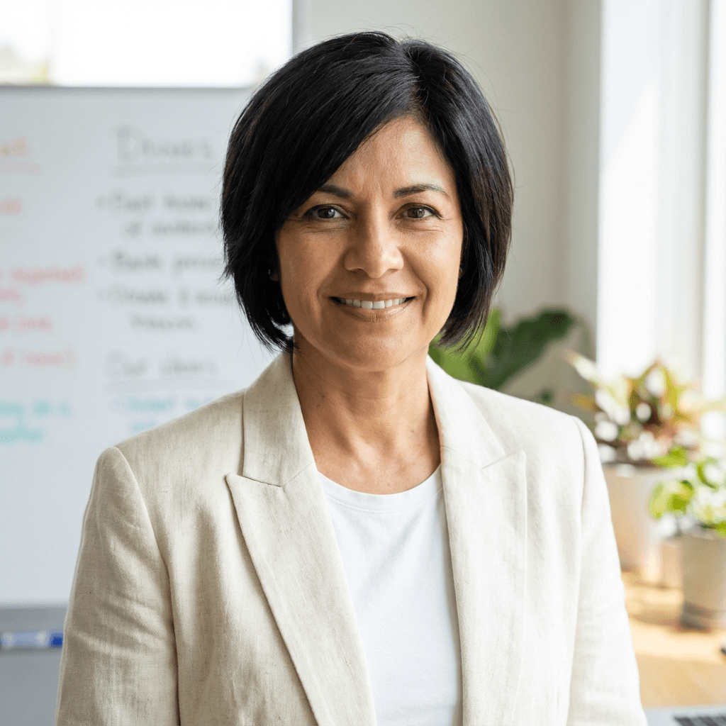Maria Gonzalez smiling in a professional blouse